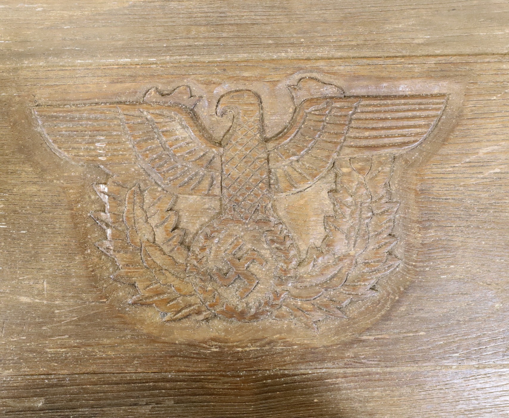 A 1930’s Third Reich carved oak fielded panel, 50cm wide